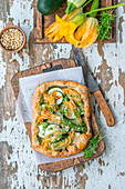 Zucchini flower pie with pine nuts