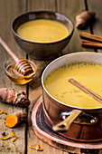 Appetizing yellow kurkuma soup with honey