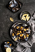 Fresh baked mussels served with lemon