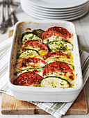 Courgette and tomato gratin made with mozzarella and parmesan cheese