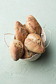 Seeded rolls in a bread basket