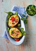 Baked avocado with spinach and cherry tomatoes