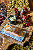 Fried salmon with potato, beetroot, and apple rostis, and a cucumber dip