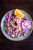 Purple cauliflower couscous with crispy almonds and leeks