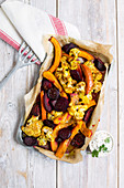 Oven-baked pumpkin with beetroot, cauliflower and a tahini dip