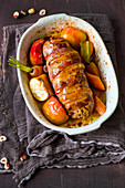 Roast pork with apples, carrots and nuts