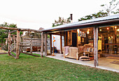 View from the garden into a converted barn with a terrace