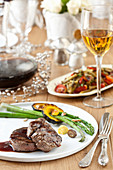 Beef fillets with sauce, asparagus and squash for the Jewish New Year