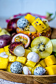 Exotic fruits on a wooden tray