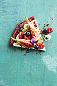 Vegan bircher muesli pizza with coconut yoghurt, figs and berries