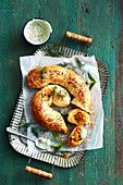 Puff pastry rolls with pumpkin filling and mint-feta sauce