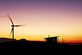 Pinwheel and hut at sunset