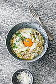 Asparagus risotto with pine nuts and an egg yolk