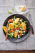 Aubergine piccata with cherry tomatoes and feta cheese