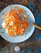 Carrot pasta with herb cream