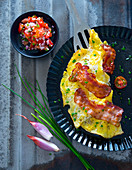 Omelette with bacon and tomato salsa