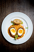 Spiced Scotch egg curry with soft chilli risotto