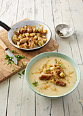 Potato and celery soup with Nuremberg sausages