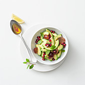 Avocado salad with grapes and pomegranate seeds