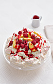 Pavlova with berries and plums