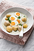Traditional Czech white dill sauce with boiled potatoes and eggs