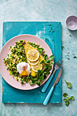 Smoked haddock on a bed of peas with wilted gem lettuce, leeks and poached egg