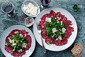 Beef carpaccio with lambs lettuce and cheese shavings