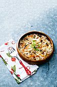 Asian egg roll cabbage salad bowl with carrots and mushrooms, topped with sliced green onions