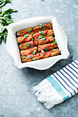 Baked cheese sticks with tomato sauce