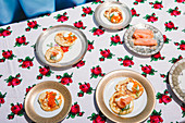 Blinis with sour cream, smoked salmon, and salmon caviar