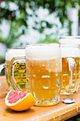 Various beers: elderberry radler and grapefruit beer on a beer garden table
