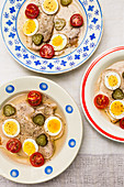 Cauliflower with egg, tomatoes and gherkins
