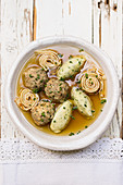 Festive soup with semolina dumplings, liver dumplings and pancake strips