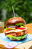 A Leberkas burger on an outdoor table