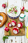 Radish flowers with a cream cheese dip and pretzels