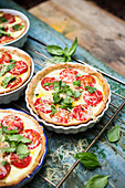 Small tomato quiches with basil