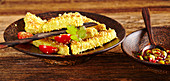 Tofu slices coated with sesame and coconut, served with sweet chili sauce (Asia)