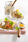 Warm quinoa salad with egg, potatoes and purslane
