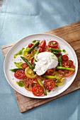 Burrata with green asparagus and tomatoes