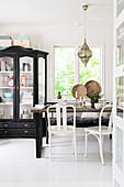 Old display case in vintage-style, black-and-white dining room