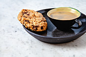 A chocolate chip cookie and an espresso