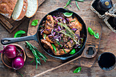 Chicken fillet pieces with red wine, onion and rosemary