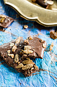 Pumpkin spice and seed chocolate almond bark with golden raisins