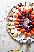 Colorful vegetable skewers or kabobs on a silver tray at a party