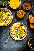 Dahi aloo tikki chaat (Indian street food made from potatoes with yoghurt and tamarind chutney)