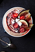 Almond milk bowl with strawberries and figs