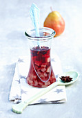Hot pear punch with red wine and star anise in a glass