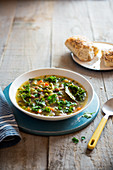 Chunky vegetable and bean soup with kale and parsley