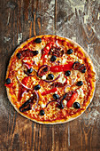 Pizza Greek style with olives, bell pepper and feta