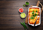 Traditional Mexican enchiladas with meat, chili red sauce and cheese
